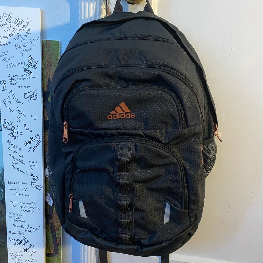 grey adidas backpack with rose gold details